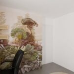 Bureau terracotta avec un papier peint panoramique pour délimiter l'espace de travail du coin nuit.